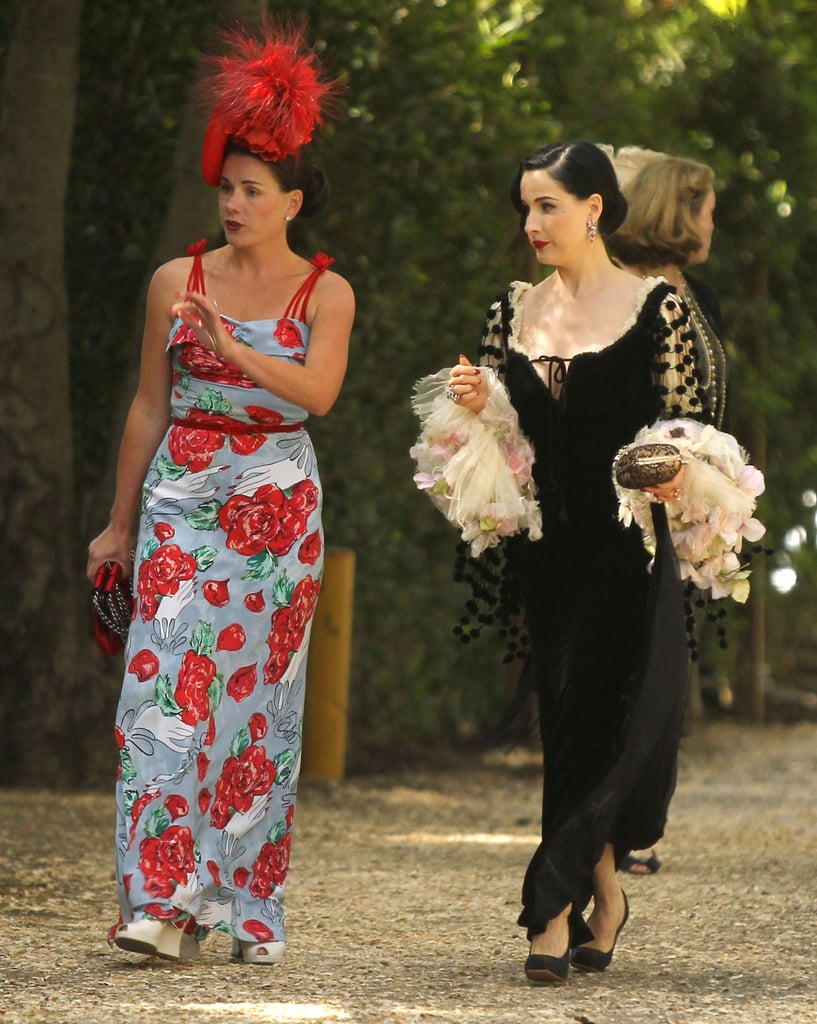 Dita Von Teese attended Aaron Paul and Lauren Parsekian's Malibu wedding in May wearing a black gown that only a burlesque queen could pull off. Get Dita's vintage-inspired feel with an equally whimsical gown, preferably with adorable pom-poms.