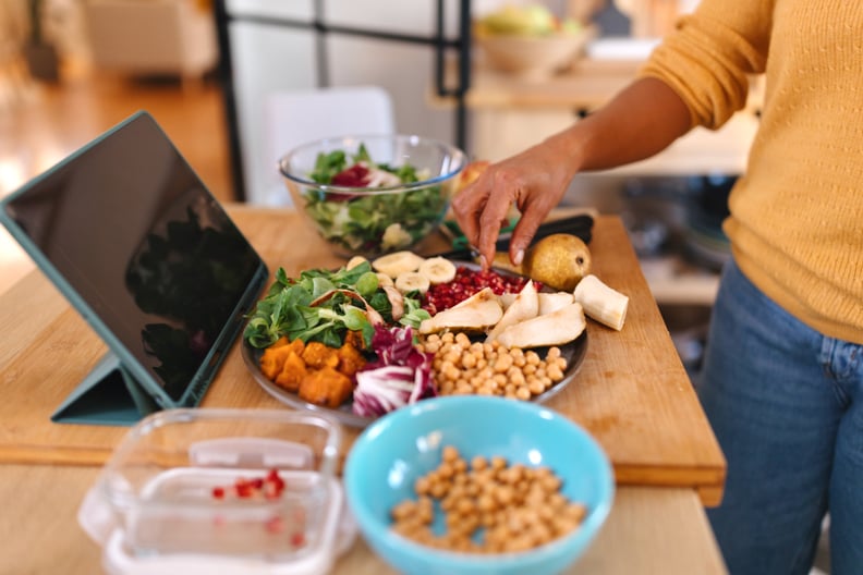 Woman preparing healthy meal in the kitchen.