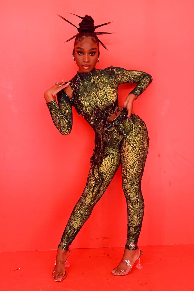 Normani Posed in a Yellow Lace Catsuit With Cutouts
