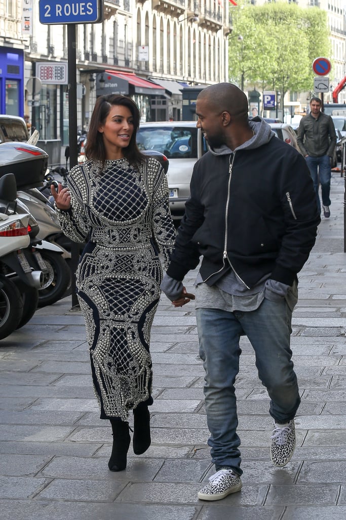 Kim Kardashian and Kanye West shared a look of love while wandering the streets of Paris, where they are reportedly getting married.