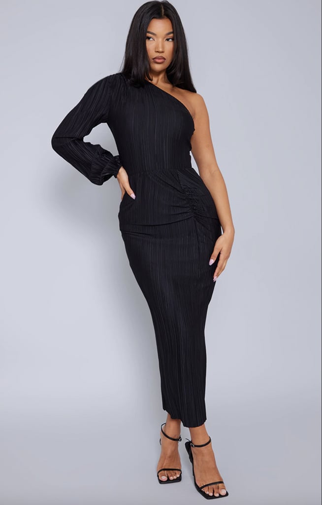 PrettyLittleThing Black Plisse One-Shoulder Ruched Midi Dress ($33, originally $73)
You can't beat London's nightlife scene. Whether you're attending a cabaret show at Lio London, indulging in a couple drinks at The Prince, or planning to catch a show in the West End, there's so much happening on any given night. With that, I recommend packing a formal black dress that can work for a variety of dress codes — just like this midi style from PrettyLittleThing. It's sophisticated, sexy, and endlessly comfortable, plus you can easily dress it up or down depending on the occasion.