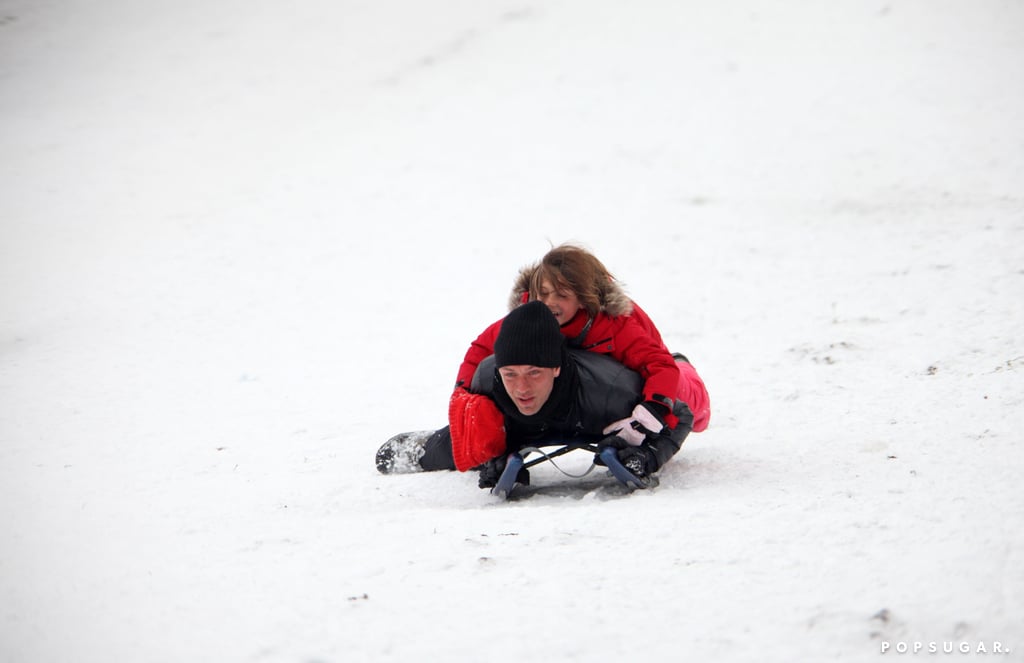 Jude Law manned the sled with his daughter Iris in London in 2010.