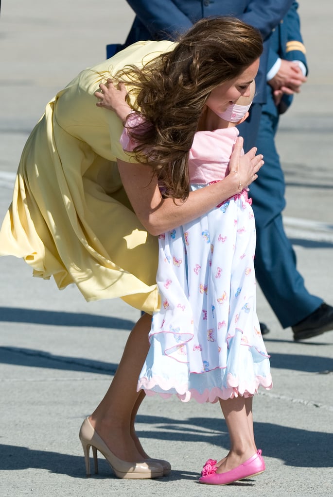 Kate hugged a sweet 6-year-old girl at the Calgary Airport during the royal couple's North American tour in July 2011.