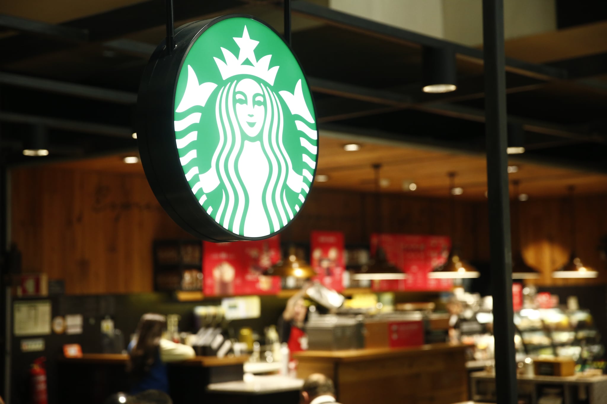 LISBON PORTELA AIRPORT, LISBON, PORTUGAL - 2019/12/11: Starbucks coffee restaurant logo seen at Lisbon Portela Airport. (Photo by Sergei Mikhailichenko/SOPA Images/LightRocket via Getty Images)