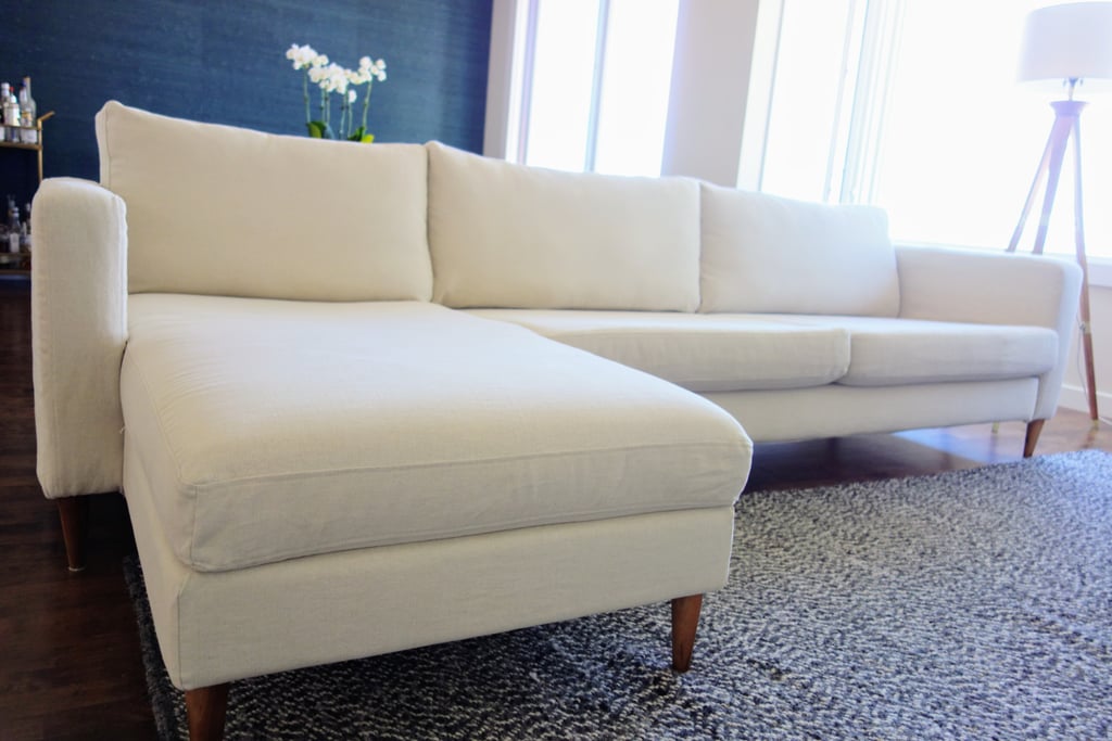 To achieve this look, I spent about two hours with my husband swapping out the covers and legs. I had to unscrew the pieces of the couch and then put it all back together once I was done. It takes similar elbow grease as your typical Ikea assembly, but just make sure you're prepared.
The project gave me a chance to bring new life to my sofa. Even just moving around and fluffing up the cushions as I changed the covers made it feel fresh. The overall finished product is luxurious. I especially love how soft the new fabric is. Instead of splurging $11,000 on a new couch, this refresh cost $899 total for the legs and covers (based on prices at the time). Well worth it for a living room makeover! 
(Note: Bemz provided the cover samples I chose free of charge.)