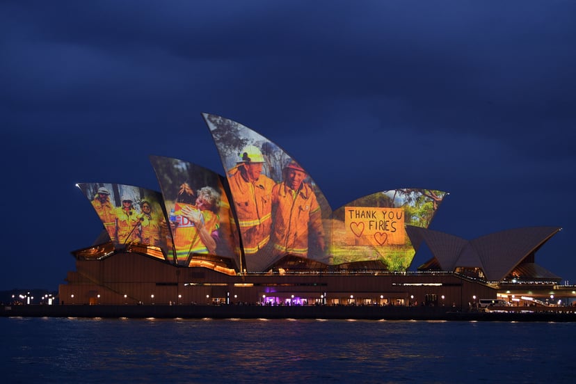 The sails of the Opera House are lit with a series of images to show support for the communities affected by the bushfires and to express the gratitude to the emergency services and volunteers in Sydney on January 11, 2020. - Massive bushfires in southeas
