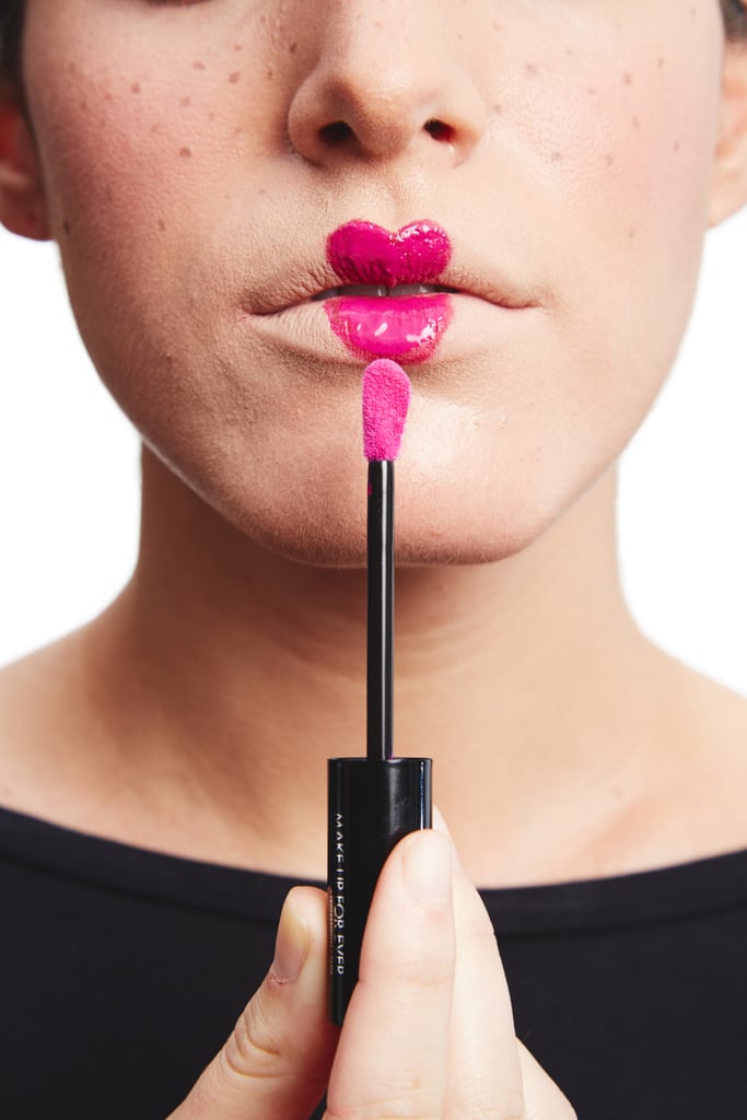 Layer on a high-shine lip gloss. The texture will create contrast and make your matte mouth fade into the background.