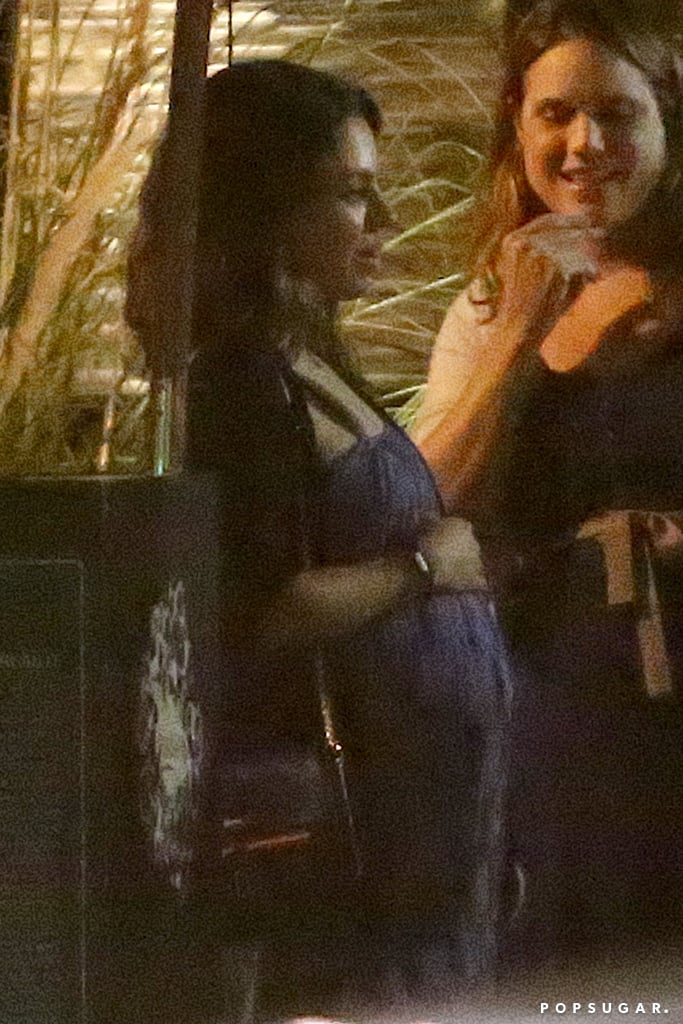 Mila Kunis Touches Her Baby Bump | Pictures