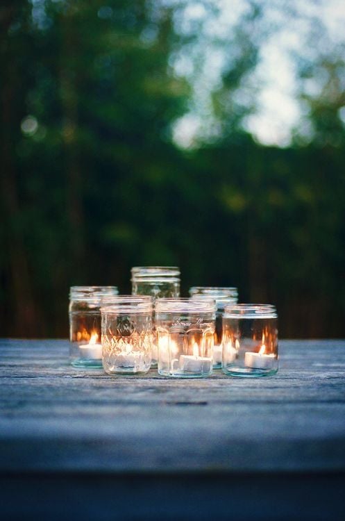 Go the simple route by arranging candles together in a mason jar.