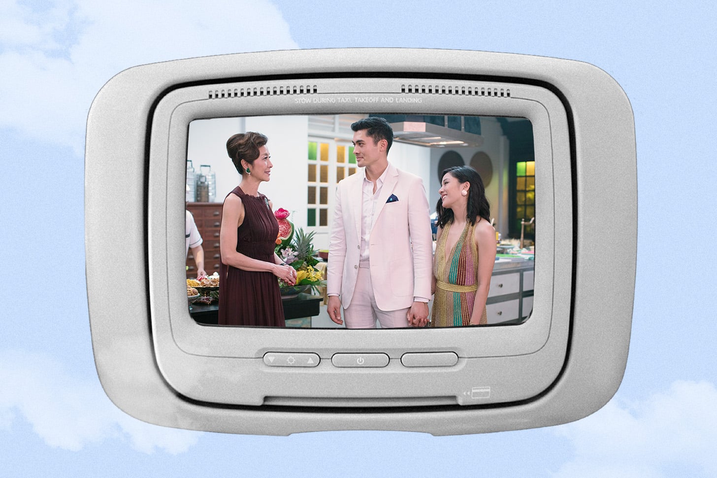 the movie Crazy Rich Asians playing on an airplane tv monitor