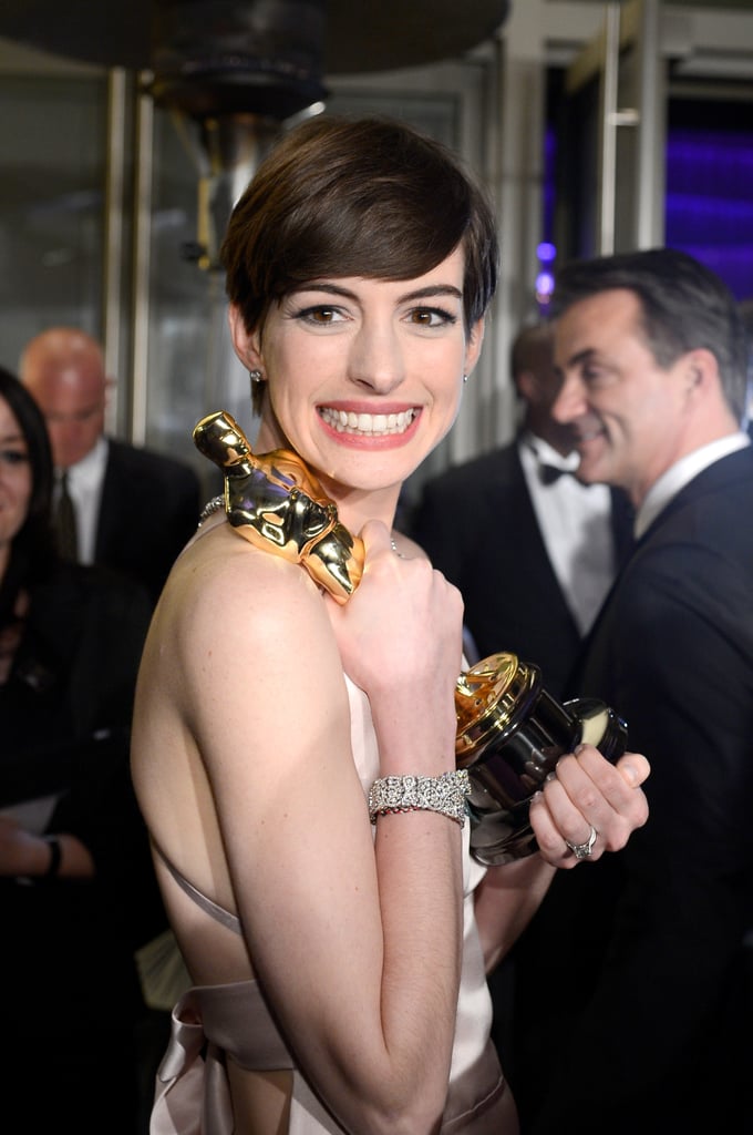 Anne Hathaway showed off her Oscar at the Governors Ball.
Anne Hathaway showed off her Oscar at the Governors Ball.