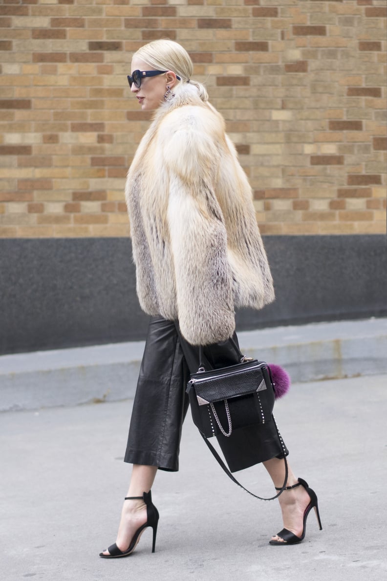 With a Furry Coat and Heeled Sandals