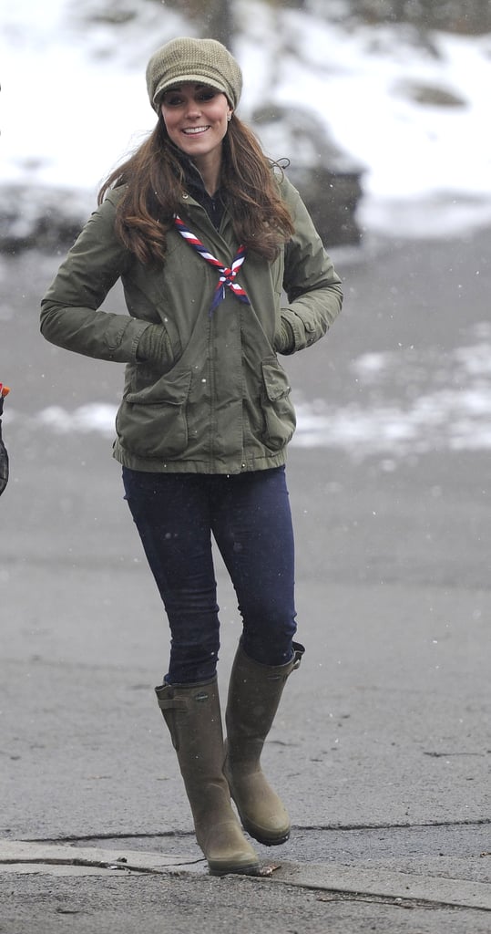 Kate matched her rainboots to a military parka and newsboy cap in the snow.