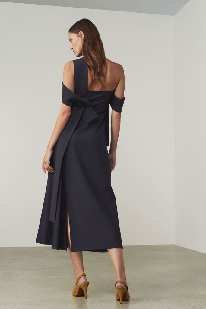 The cut of this dress is incredibly elegant, and the back is simply stunning while also discreet. Could a wedding guest outfit be any more perfect?