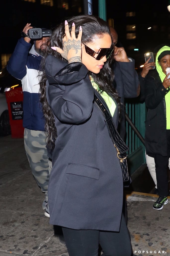 Casually Moving Her Hair to the Side to Show Off Her Fenty Glasses