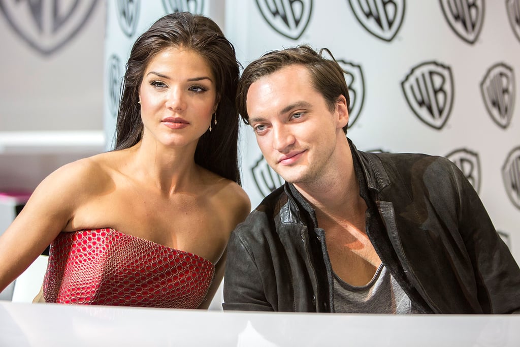 Pictured: Marie Avgeropoulos and Richard Harmon.