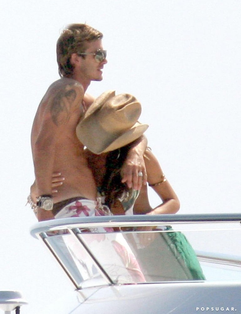 David Beckham and Victoria Beckham cuddled up on a yacht together in June 2005 while in Saint-Tropez.