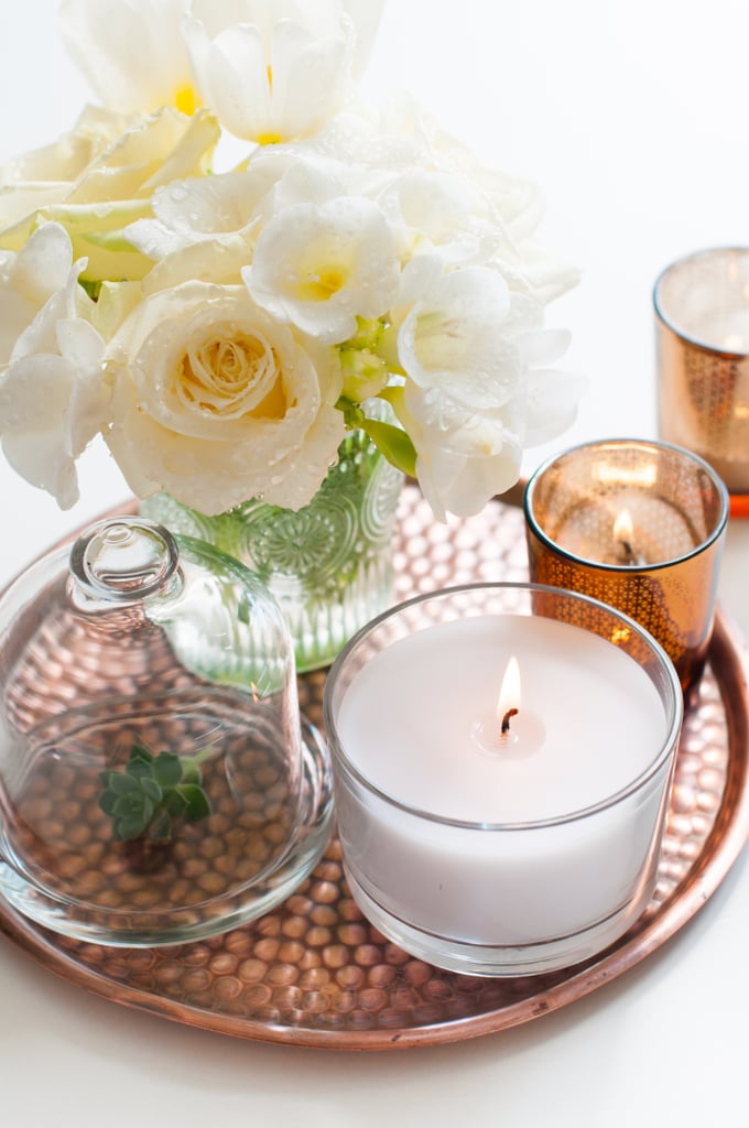 Add a candle to your vanity tray and complete the look with fresh flowers.