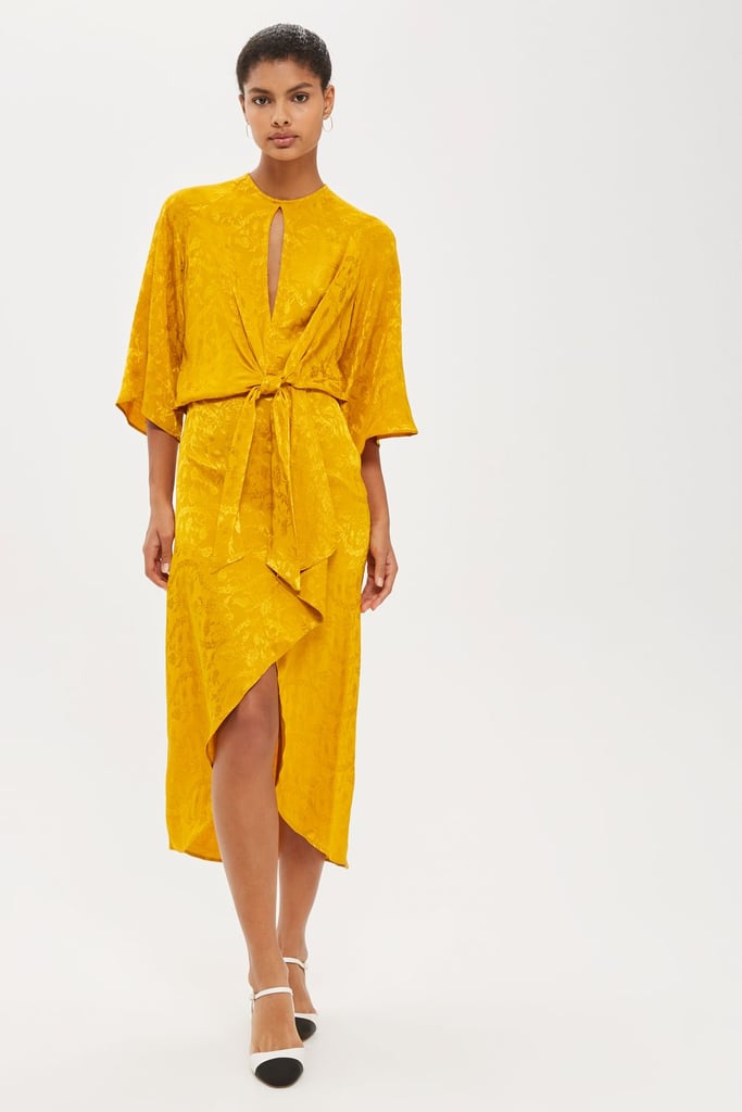 In on-trend marigold, this silky Topshop Jaquard Knot Front Midi Dress ($110) feels retro and modern at the same time.