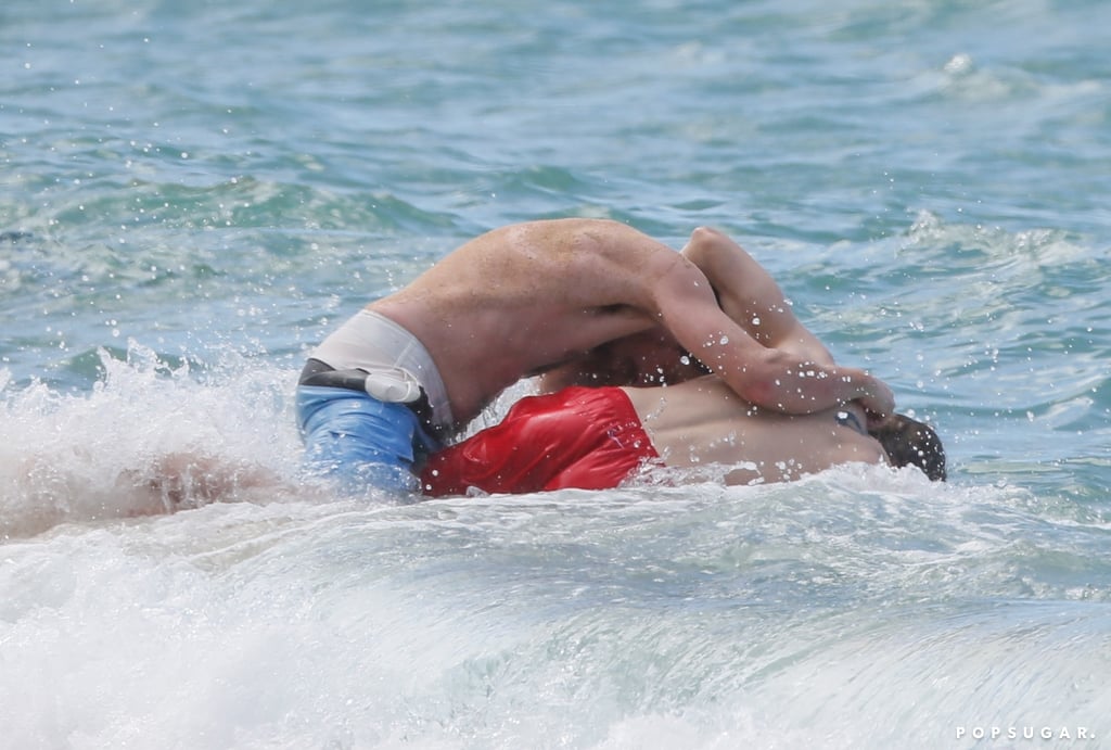 Charlie Hunnam and Garrett Hedlund Wrestle in Hawaii Photos