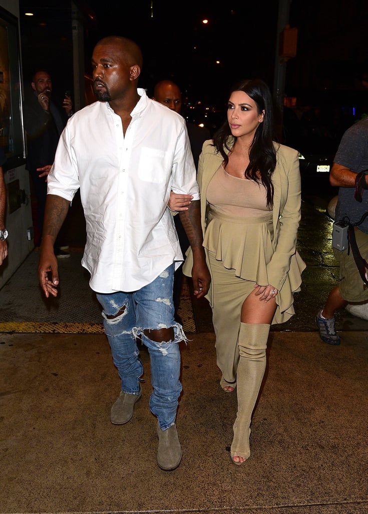 Kim's first look of New York Fashion Week consisted of Givenchy Resort 2016 separates, including a ruffled thigh-slit skirt and a complementing blazer, along with over-the-knee peep-toe Yeezy boots that Kim was the first to debut on the streets.