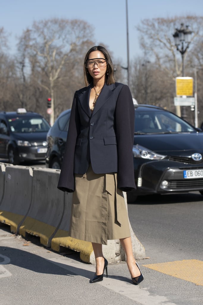 Have some fun with your work-friendly blazer blazer and skirt by styling them with '70s clear sunglasses.