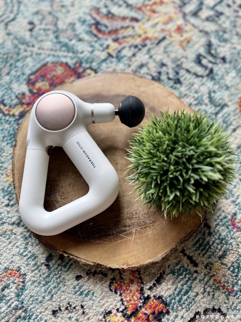 Therabody Theragun Sense Percussion Massage Gun ($300) 
The Theragun Sense is an easy gifting answer for anyone who works out. It offers 12mm percussive massage therapy with five speeds to choose from and four different attachments. Not only does it have an LCD screen that allows for easy control and programming, it has a biometric sensor for heart rate readings and a bluetooth connection so you can work your device alongside the app. My personal favorite reason for gifting this product? It's great for people who may not be total gym buffs, but appreciate breathwork sessions. There are a whole slew of meditative sessions to choose from. Read my full Therabody Theragun Sense massage gun review for more.
Editor Quote: "What makes the Therabody Theragun Sense different from all other massage guns on the market is the ability to practice breathwork through guided sessions on the app. The Sense uses vibration cues to guide you through the breathwork sessions, and will show your minimum heart rate post-session to show you how much you relaxed. The breathwork is particularly great for those of us who easily get distracted while meditating. It removes the stress of having to close your eyes and block out the rest of the world, which, personally, put me more at ease." — Sarah Wasilak, shopping director
