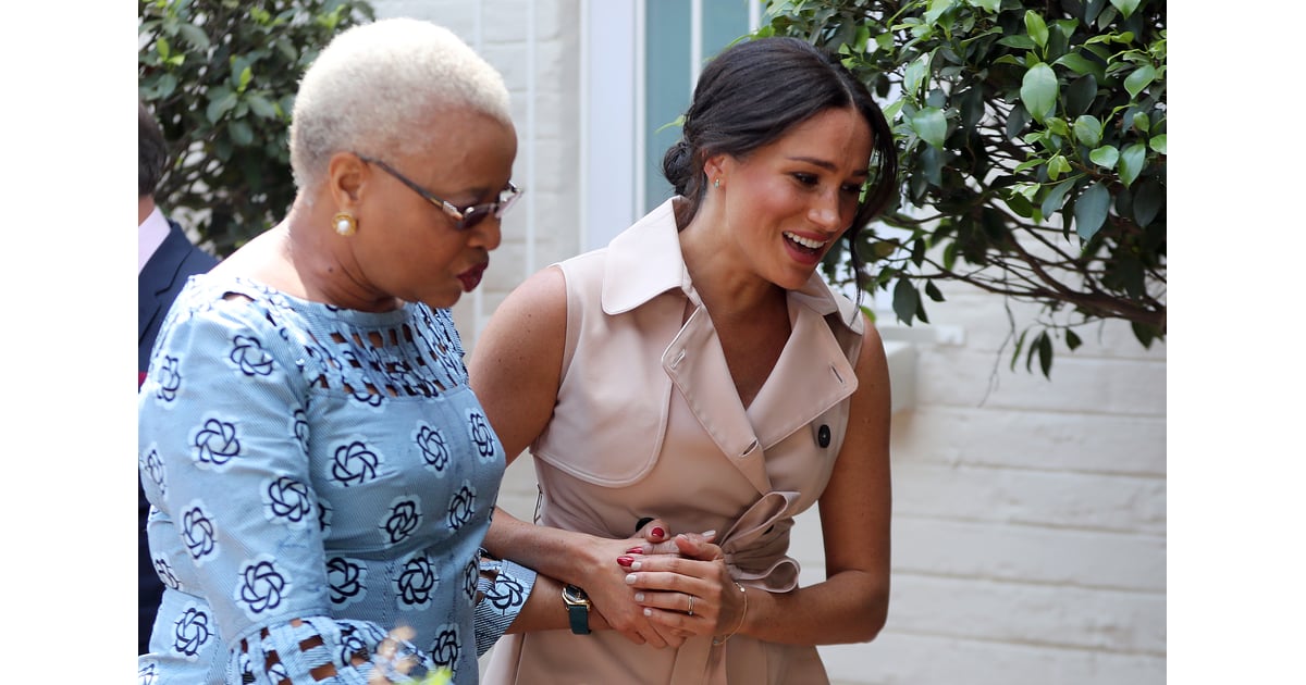 Meghan Markle Wearing an Evil Eye Bracelet and Beige Trench Dress ...