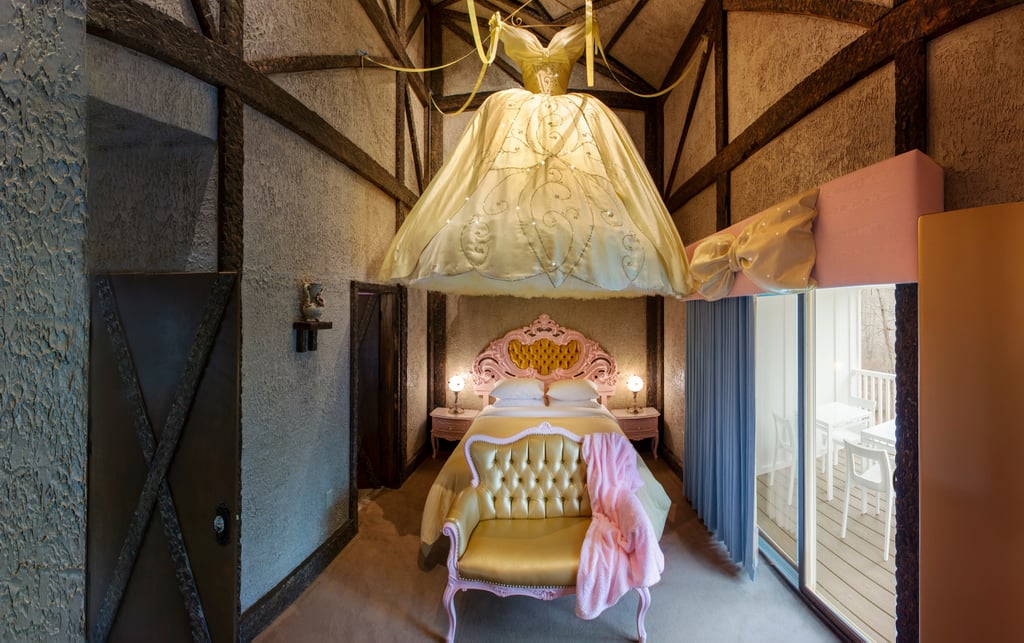 A Cozy Cottage Room With a Canopy Bed Made Out of Cinderella's Ball Gown