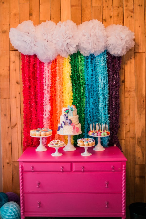 The dessert table is the centerpiece of any party. I wanted Ally’s table to be bright, colorful, and scream Pony Power!  My friends at Shop Sweet Lulu have a darling rainbow backdrop tutorial on their site that I was able to easily replicate with my own spin. You can see theirs here along with purchase supplies to create your own!  I loved the backdrop so much I literally took it home with me assembled in case I want to reuse it for St. Patricks day!!