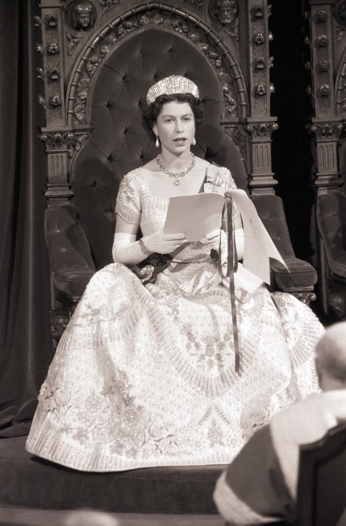 In 1957, Queen Elizabeth II became the first reigning monarch to open a session of the Canadian Parliament. She wore her Norman Hartnell coronation dress and an array of significant diamonds and pearls. Queen Alexandra's Kokoshnik tiara took centre stage, which was designed to resemble one owned by her sister, Empress Marie Feodourovna of Russia. The look was finished with the Coronation necklace and Queen Victoria's pearl drop earrings. Over her opera-length gloves, she wore a diamond watch and the Edinburgh wedding bracelet.