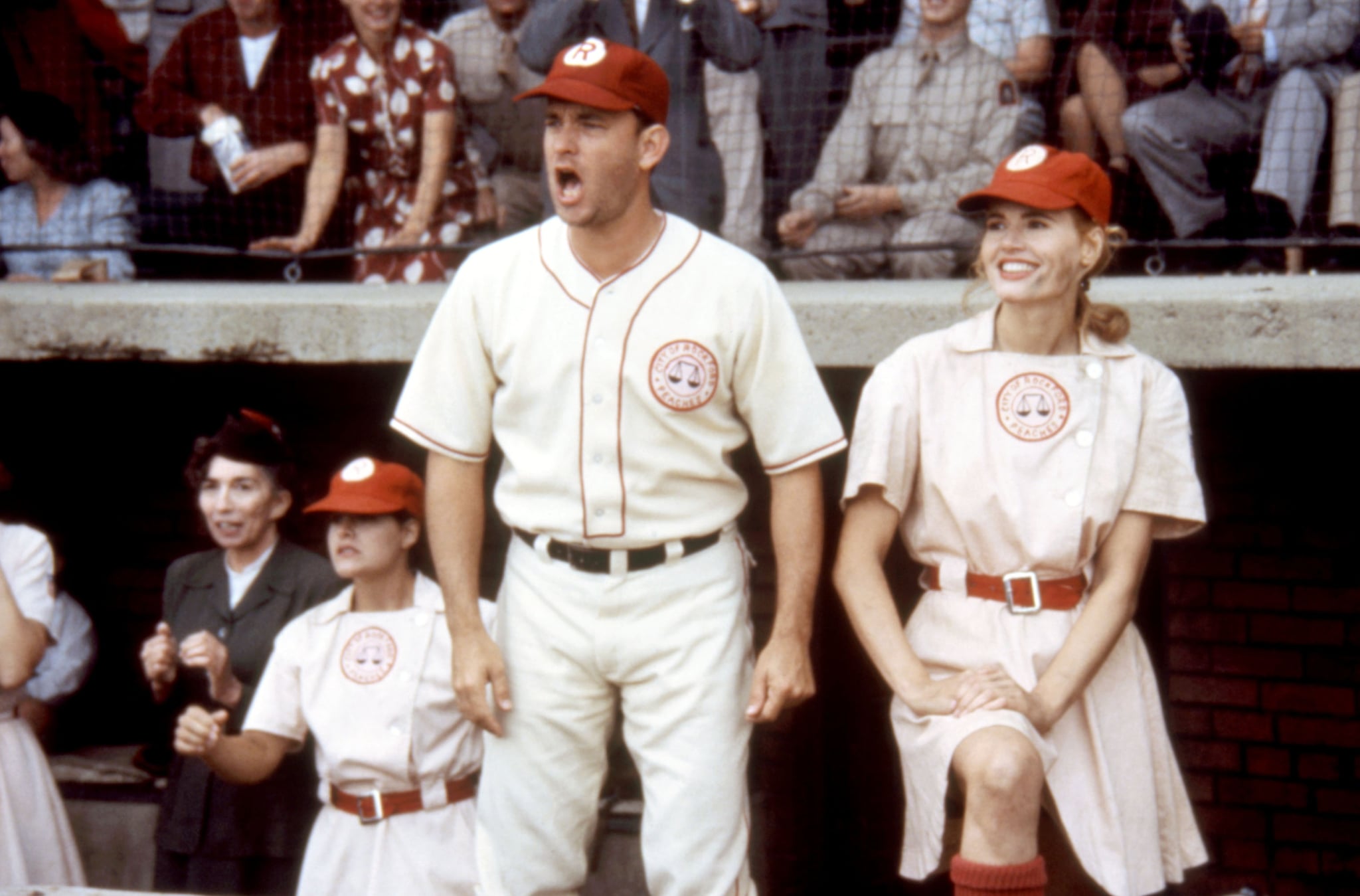 A LEAGUE OF THEIR OWN, foreground: Tom Hanks, Geena Davis, 1992.  Columbia Pictures/ Courtesy Everett Collection.