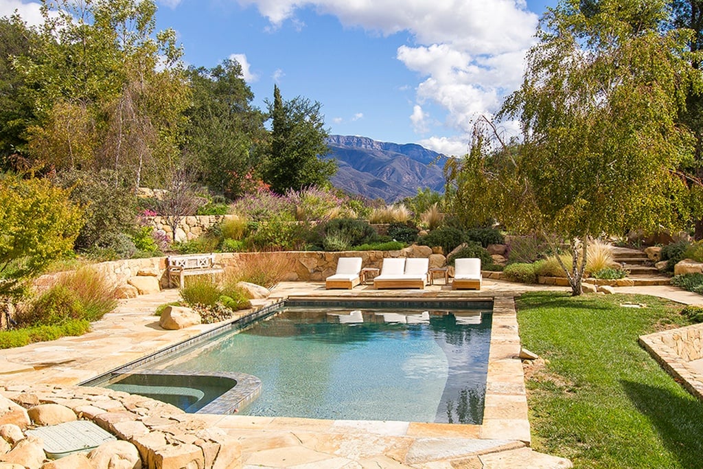 The pool and spa are situated amidst breathtaking mountain views.