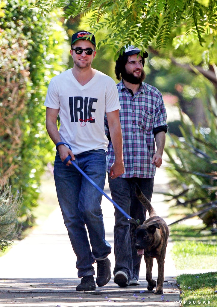 Robert Pattinson took Bear, a dog he adopted in New Orleans, for a guys' walk in LA in July 2011 with Tom Sturridge.