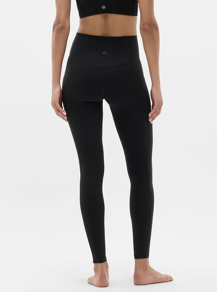 Athleta Salutation Stash High Rise Legging ($109)
These Athleta leggings are our go-to when we want to feel comfy but still held in. They are great for lower-impact workouts (where you aren't getting drenched in sweat), or for wearing out and about. Don't worry, your butt will still look great.

Pros: Bonded side stash pockets that easily hold your essentials (phone, keys).
Cons: Some users say the waistband runs snug; you might size up for extra comfort.
Material: Polyester, LYCRA. 
Length:  25", 27", 30"
Colorways: 11
 Sizes:  XXS-XXL
Who it's best for:  Anyone needing secure pockets without extra bulk
Extras: Seamless feel with no side seams — great for distraction-free workouts.

What Reviewers Say: "The material feels thick and good quality. I wanted a pair of leggings with the side pockets to stash my phone and these are perfect for that. They feel really good on."
