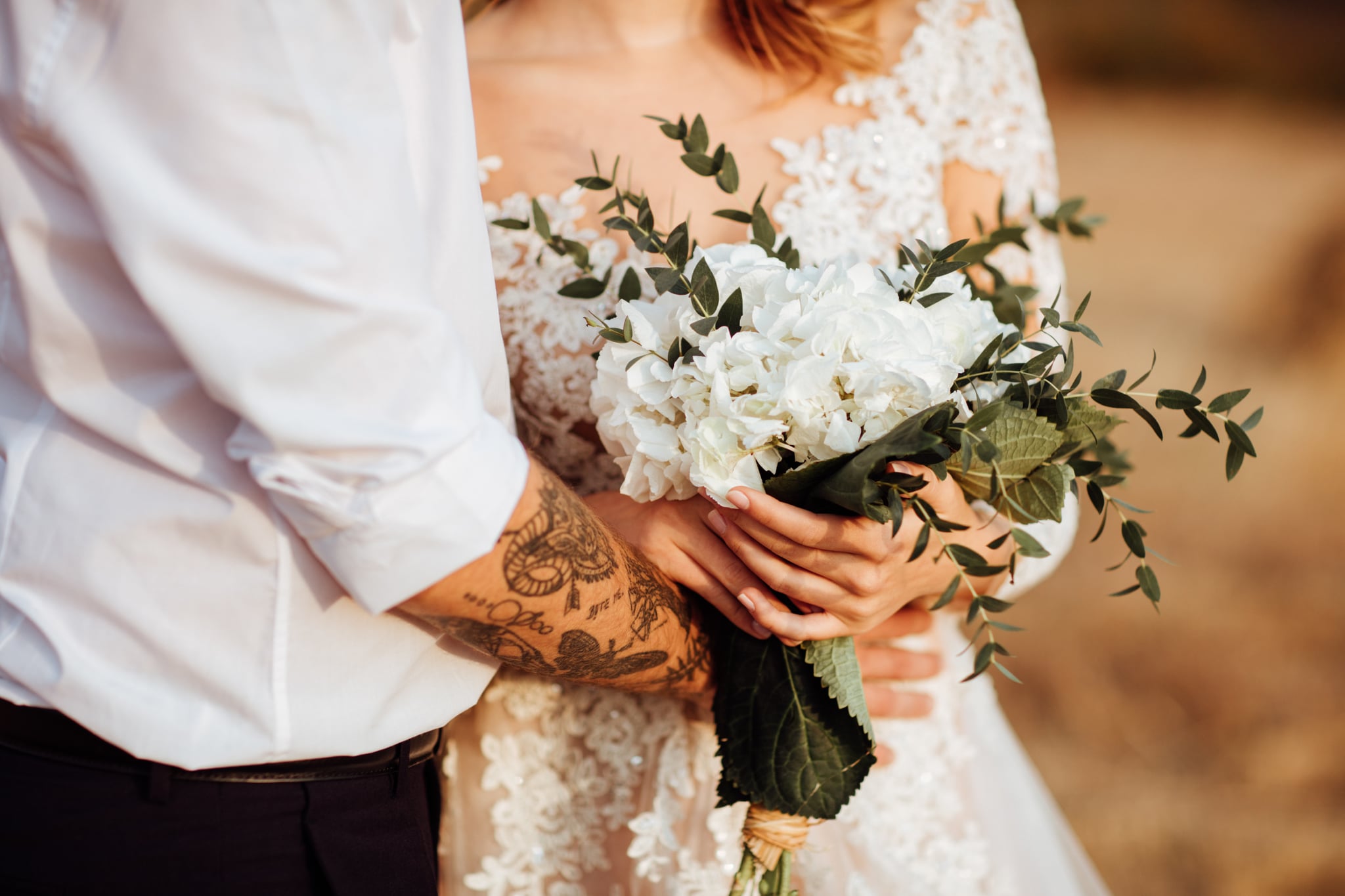 Close Up Image of a Bride Holding a Bouquet of Flowers