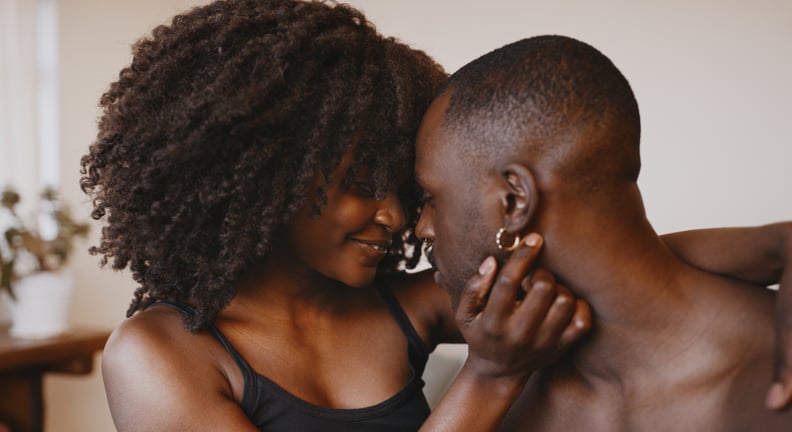 Affectionate Young Couple Leaning In For Kiss
