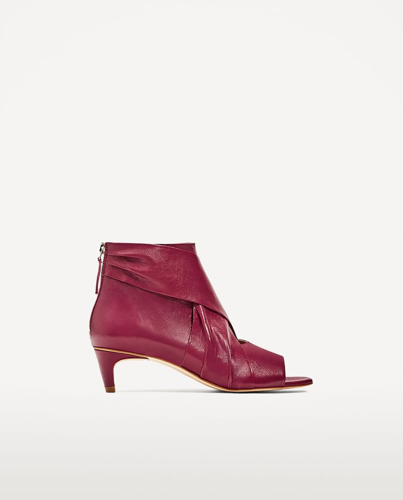 Zara tries out the look with its Leather Ankle Boots ($119)