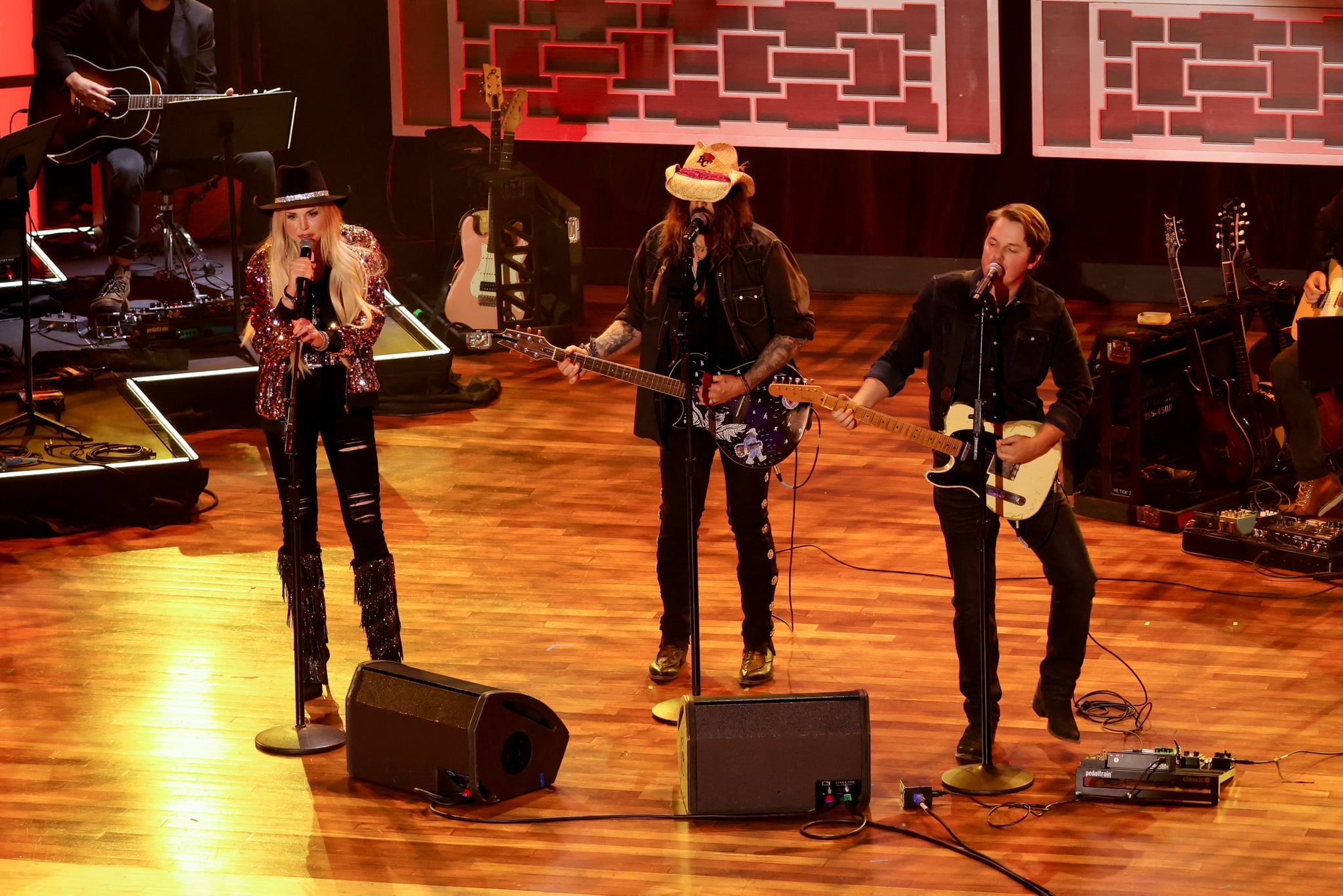 FIREROSE, Billy Ray Cyrus and Travis Denning perform onstage at the 16th Annual Academy of Country Music Honours at Ryman Auditorium on August 23, 2023 in Nashville, Tennessee. (Photo by Maggie Friedman/Variety via Getty Images)