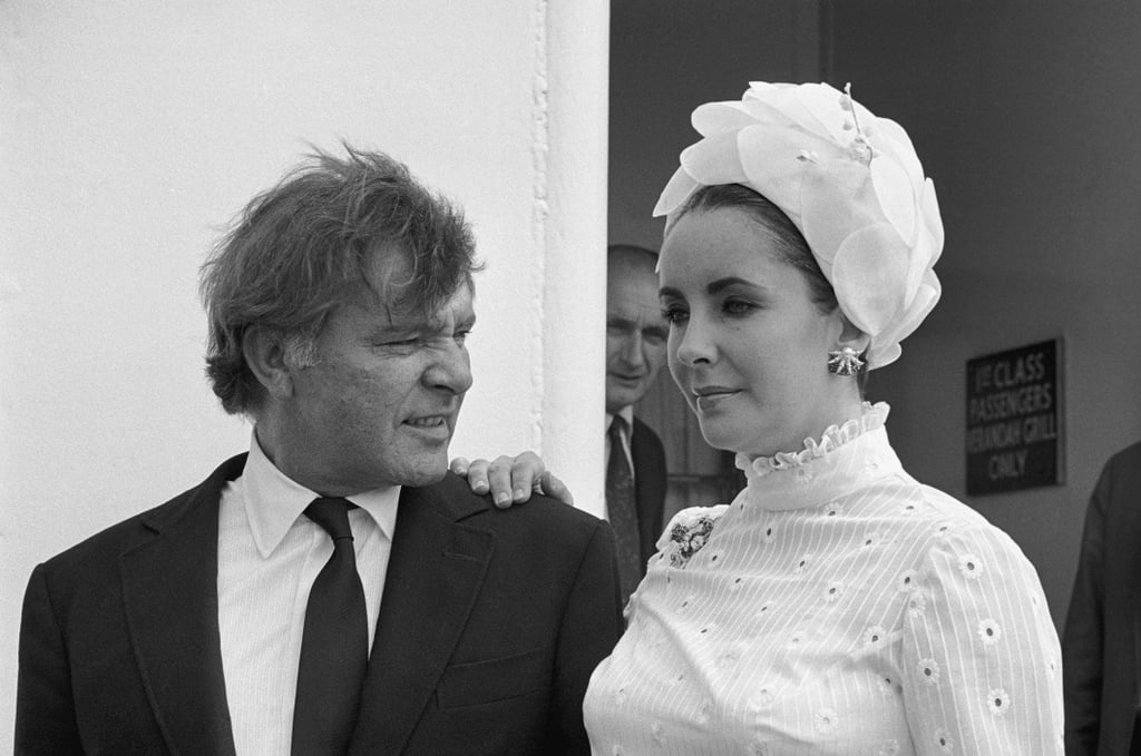 Elizabeth wore a white-petal headwrap while boarding an ocean liner with husband Richard Burton in 1968.
