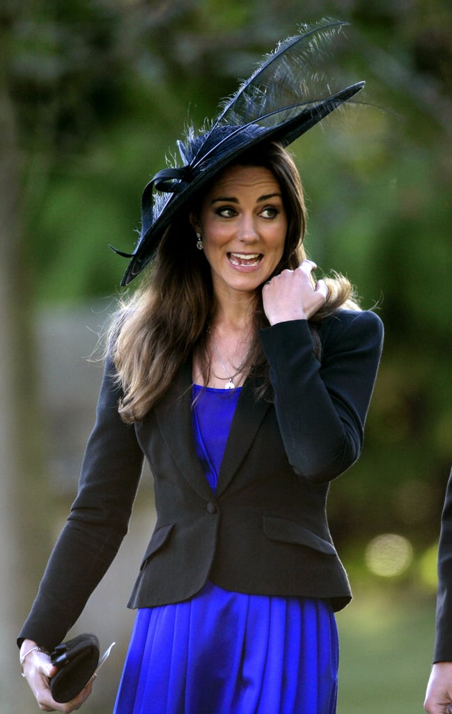 The then-girlfriend of Prince William attended a wedding in a feather-trimmed wide-brim hat in 2010.
