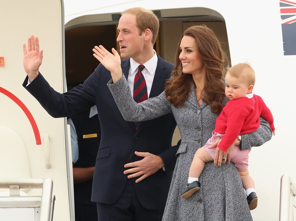 Kate Middleton in a tweed coat dress with Princes William and George in April 2014 arriving in Canberra, Australia.