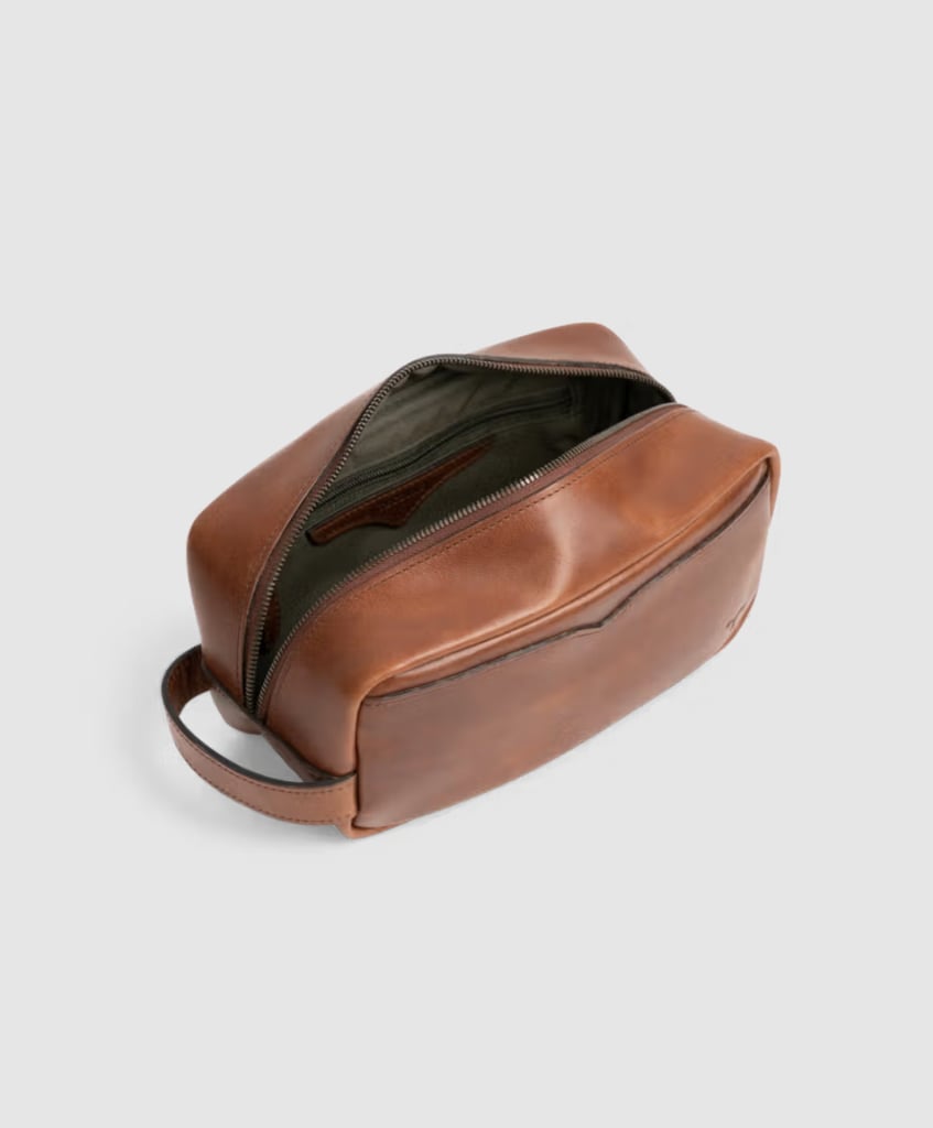 Tecovas Bartlett Travel Kit ($125)
Level up your dad's toiletry bag. The main compartment is spacious enough to fit shaving and grooming essentials with a hidden interior zipper to maximize organization. Plus, the external handle makes it easy to grab on the go.