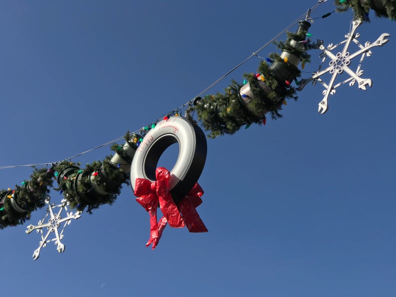 Tire wreaths hang high over the main street of Cars Land.