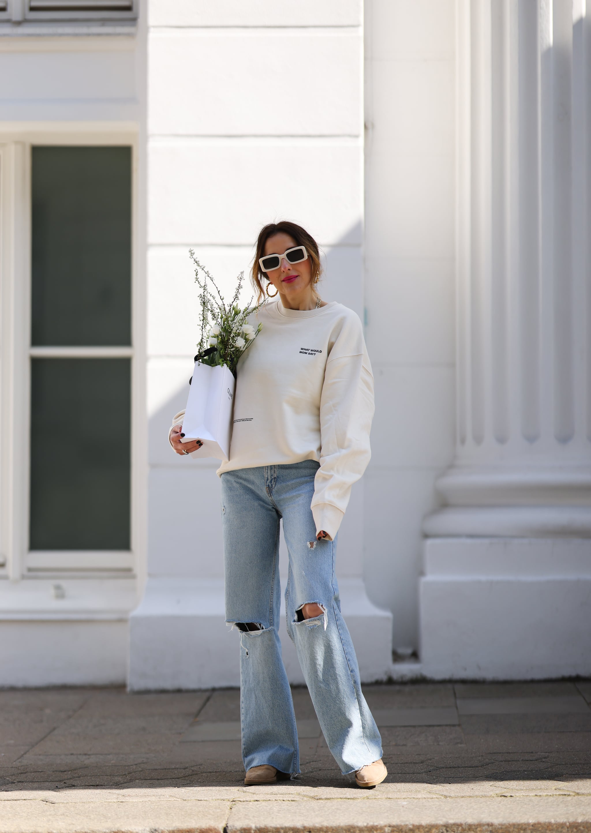 Hailey Bieber Wore a Tiny White Tank Top With the Baggiest Puddle Pants