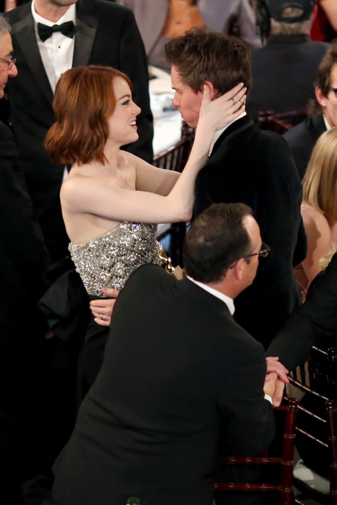Emma Stone grabbed Eddie Redmayne for a moment.