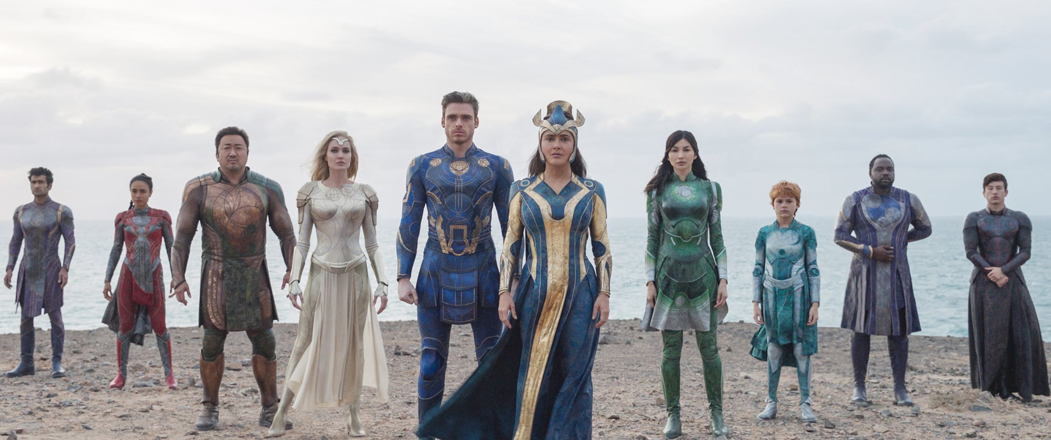 ETERNALS, from left: Kumail Nanjiani as Kingo, Lauren Ridloff as Makkari, Ma Dong-seok as Gilgamesh, Angelina Jolie as Thena, Richard Madden as Ikaris, Salma Hayek as Ajak, Gemma Chan as Sersi, Lia McHugh as Sprite, Brian Tyree Henry as Phastos, Barry Keoghan as Druig, 2021.  Walt Disney Studios Motion Pictures /  Marvel Studios / Courtesy Everett Collection