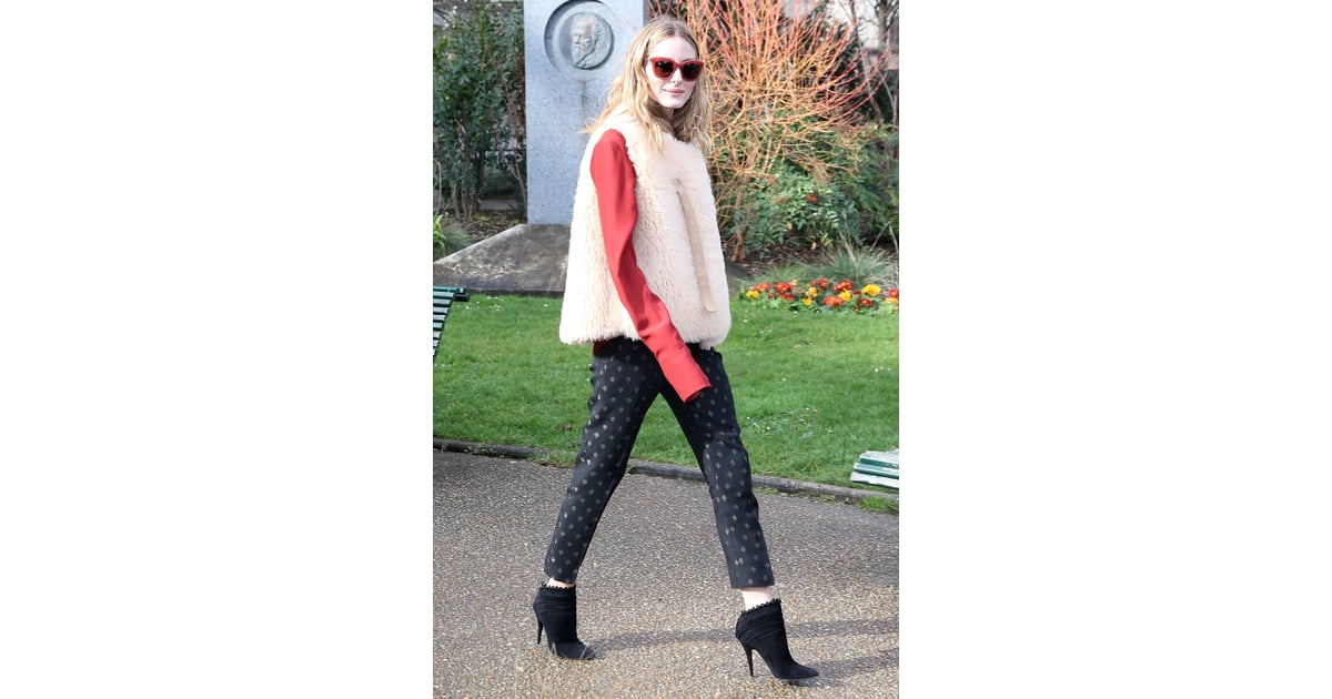 With a shearling vest, Olivia transformed printed pants, a blouse ...