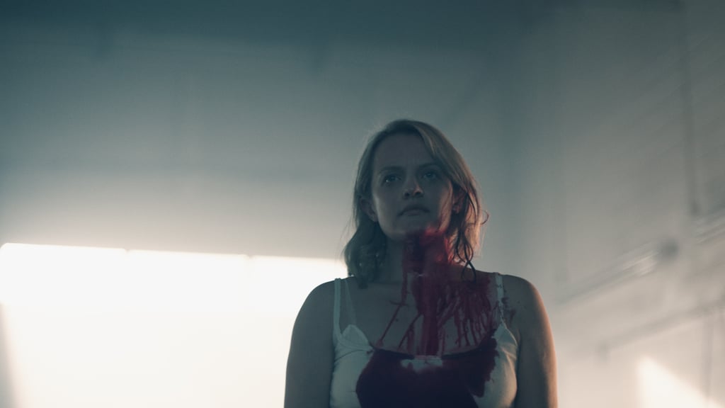 If you recall, Offred (Elisabeth Moss) is carted off to a mysterious and unknown place at the end of season one. We don't know where she goes, but now we know she ends up covered in blood at some point, which does not bode well. Does she murder someone? Is some deviant murdered in front of her?! We're nervous.