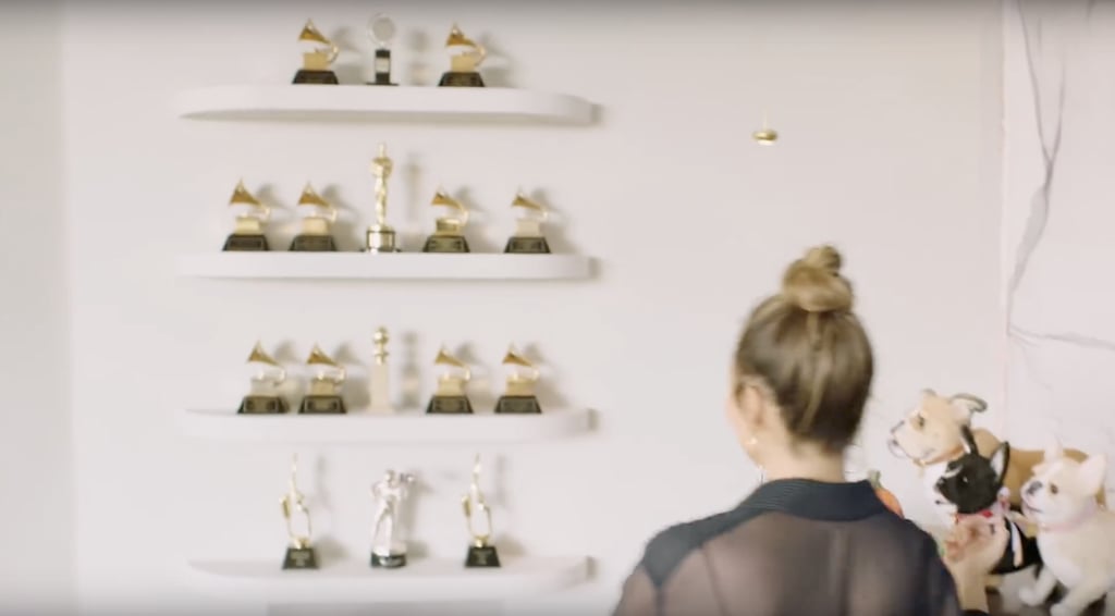 Who doesn't have a wall filled with all their trophies? If you're John Legend, it means something a little more impressive (ours is basically just soccer trophies from grade school), as he's displayed all of his Grammy and Oscar winnings in one creative space.